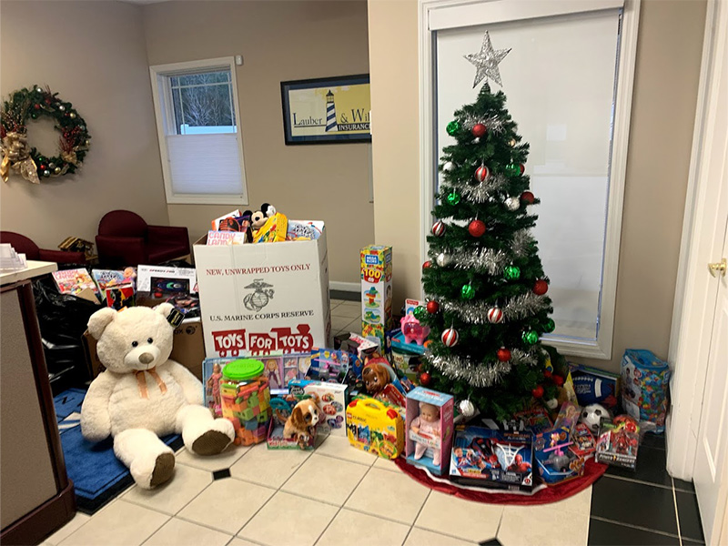 Community Involvement - Toys for Tots Gifts Donated Under Christmas Tree